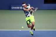 Taylor Fritz hits a forehand